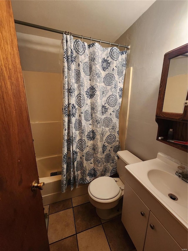 bathroom with toilet, shower / bath combo, vanity, and tile patterned floors