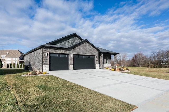 view of front of home with a garage and a front yard