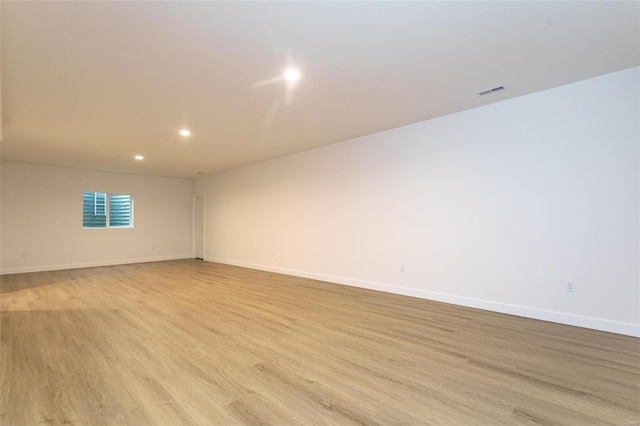 spare room featuring light wood-type flooring