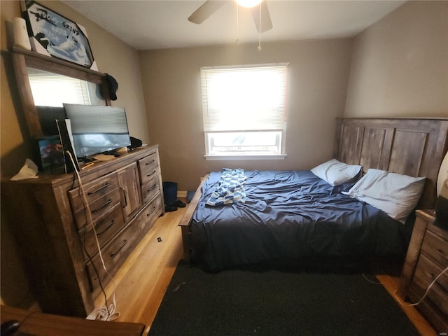 bedroom with ceiling fan and wood finished floors