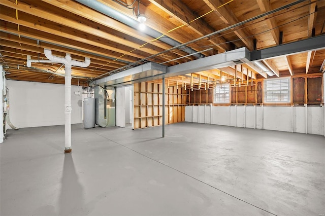 basement featuring heating unit and water heater