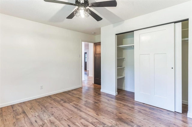 unfurnished bedroom with wood-type flooring and ceiling fan