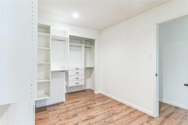 walk in closet featuring light hardwood / wood-style floors