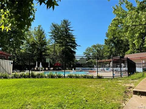 view of pool featuring a yard