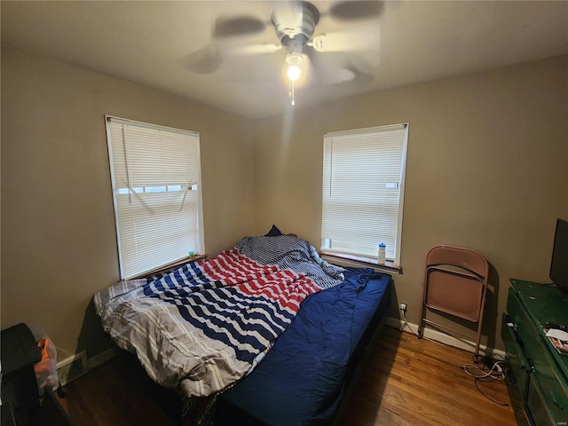 bedroom featuring wood-type flooring and ceiling fan