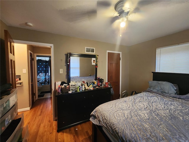 bedroom with ceiling fan and light wood-type flooring