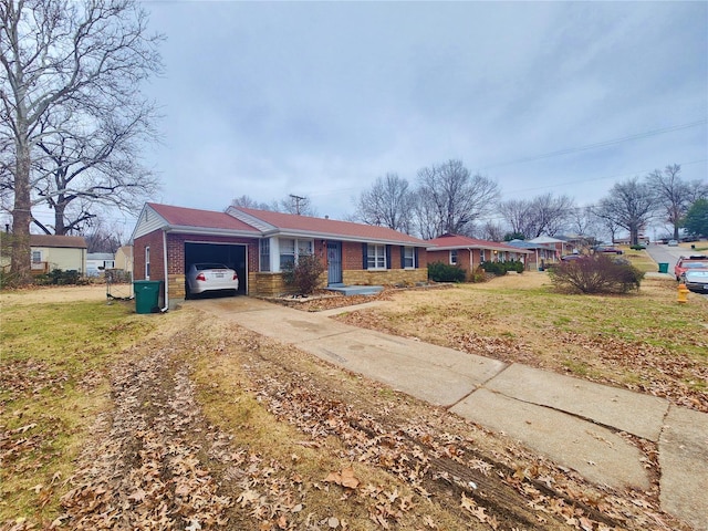 ranch-style house featuring a garage, concrete driveway, brick siding, and a front lawn