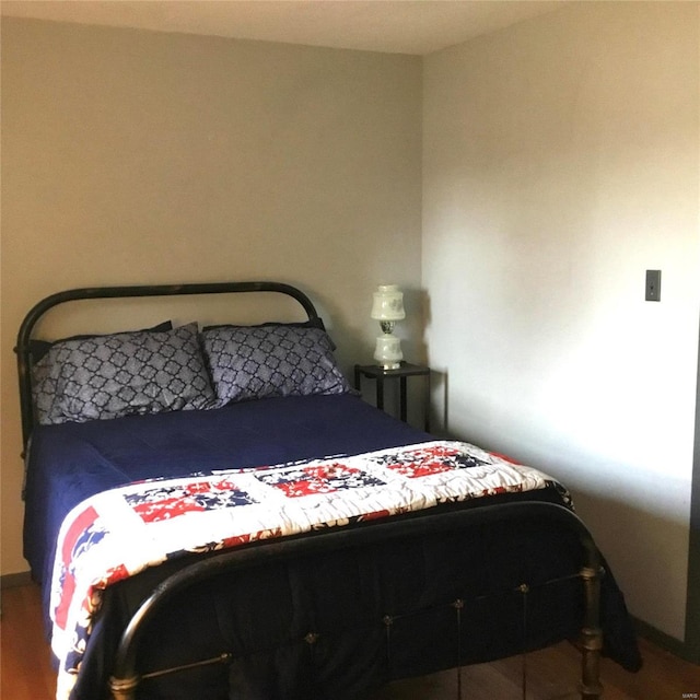 bedroom featuring wood-type flooring