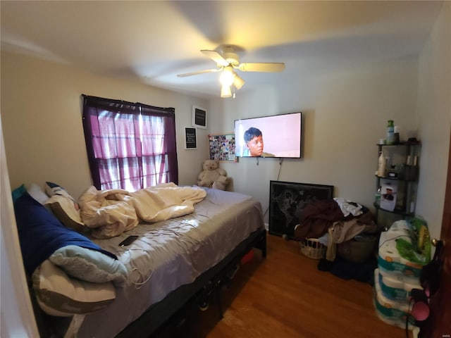 bedroom featuring ceiling fan and wood finished floors