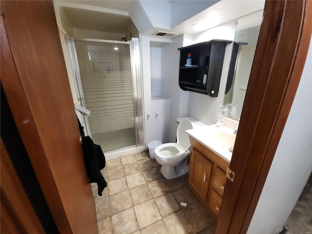 bathroom featuring visible vents, toilet, a shower stall, and vanity