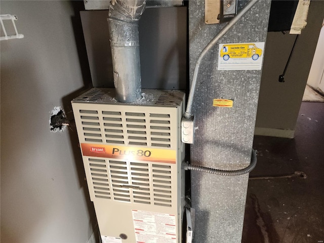 utility room featuring heating unit