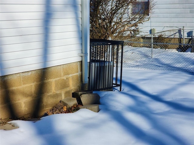 exterior details featuring central air condition unit and fence