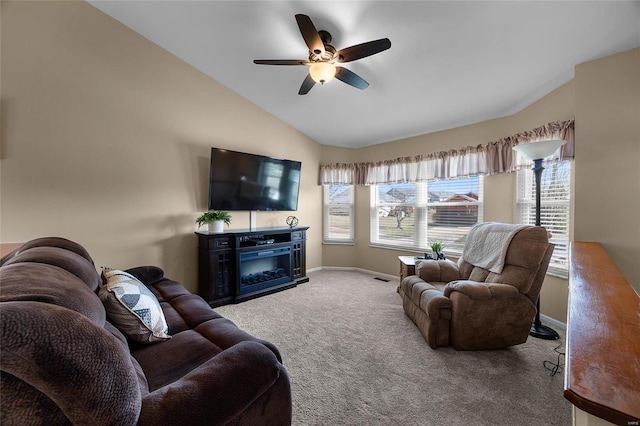 carpeted living room featuring visible vents, a fireplace, baseboards, ceiling fan, and vaulted ceiling