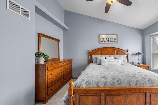 bedroom with light carpet, visible vents, ceiling fan, and vaulted ceiling