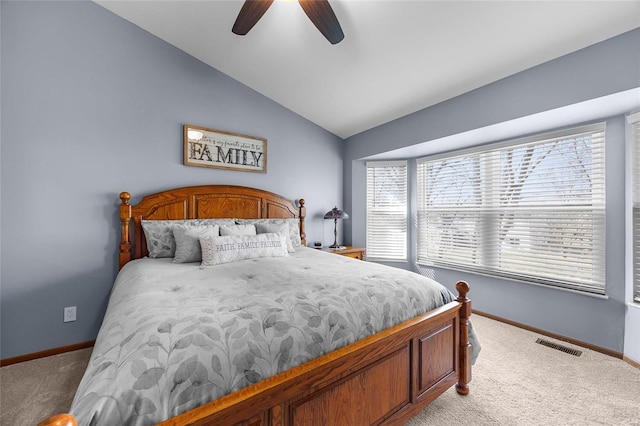 bedroom with carpet, visible vents, baseboards, ceiling fan, and vaulted ceiling