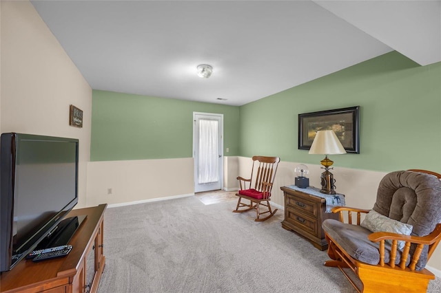 sitting room with baseboards and carpet floors