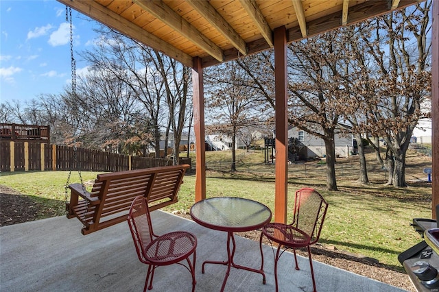 view of patio / terrace featuring fence