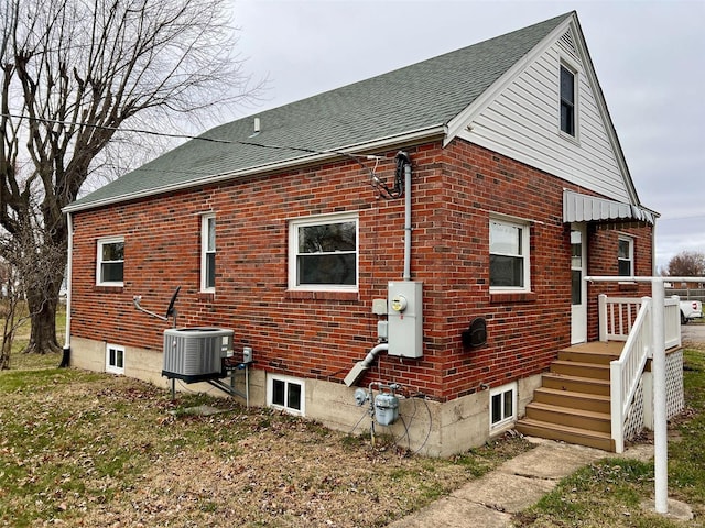 view of home's exterior with central AC unit