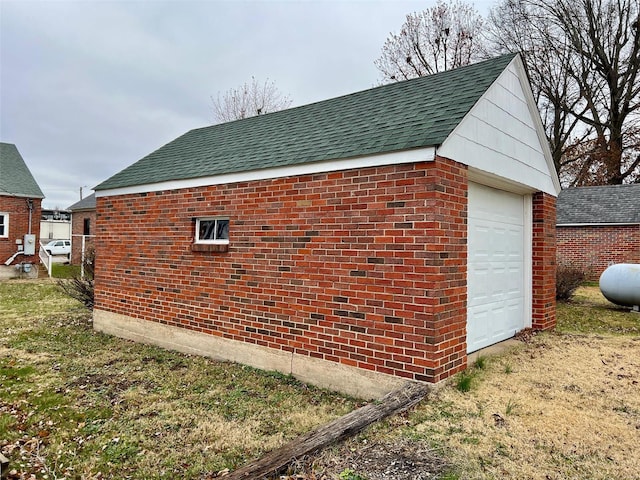 view of side of home with a garage and an outdoor structure