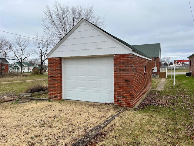 garage featuring a yard