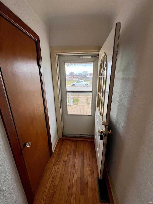 doorway with light hardwood / wood-style floors