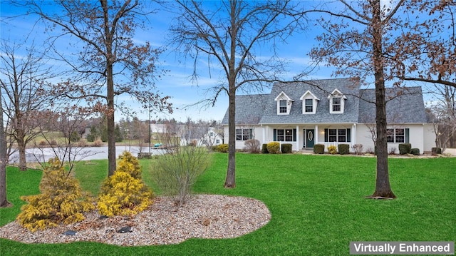 cape cod house with roof with shingles and a front lawn