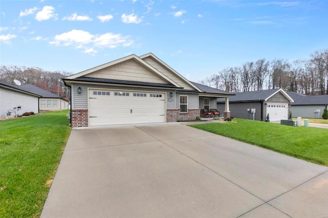 view of front of home with a front yard and a garage