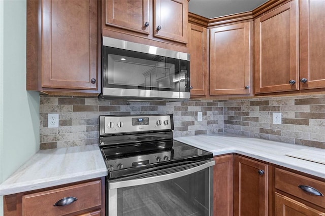 kitchen featuring decorative backsplash and stainless steel appliances