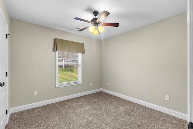 carpeted empty room featuring ceiling fan