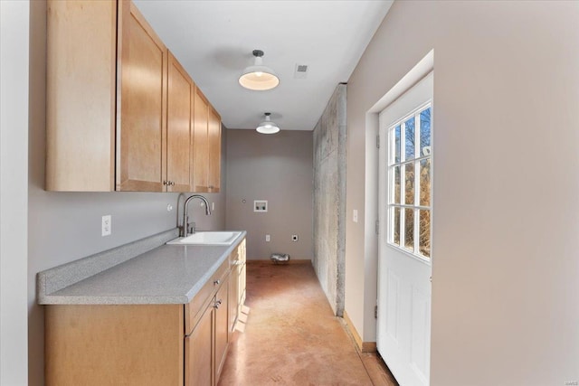 kitchen with sink and light brown cabinets