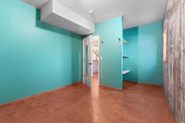 unfurnished bedroom featuring concrete flooring