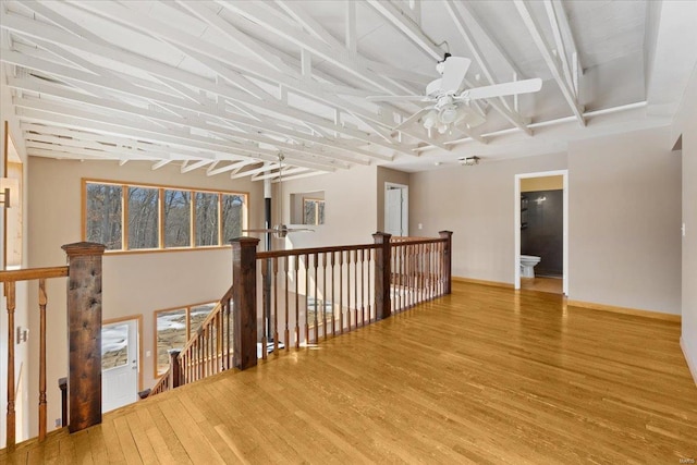 corridor featuring hardwood / wood-style floors