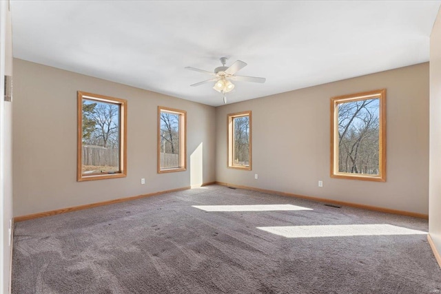 carpeted empty room with ceiling fan