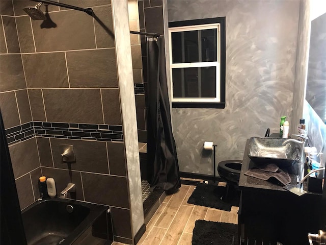 full bathroom featuring hardwood / wood-style flooring, vanity, toilet, and shower / tub combo with curtain