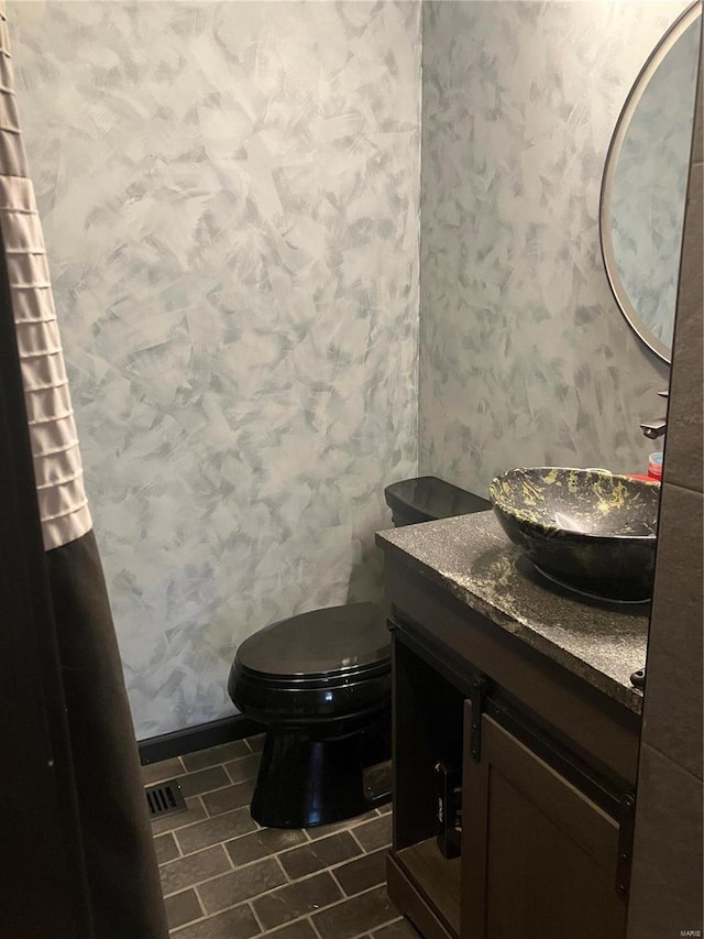 bathroom with vanity and toilet