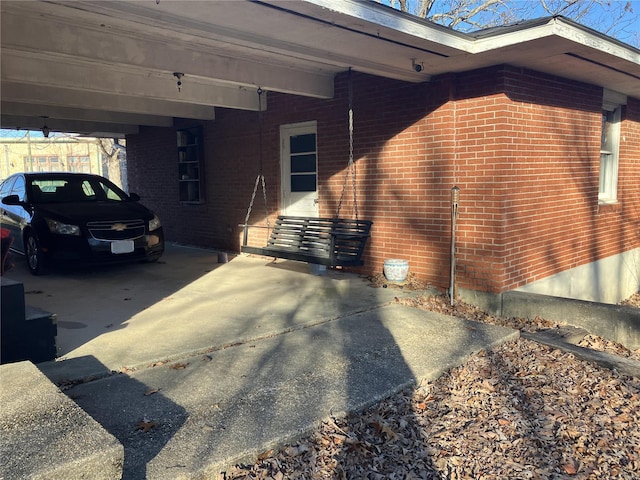 view of side of property with a carport