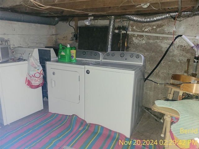 laundry area featuring washing machine and clothes dryer