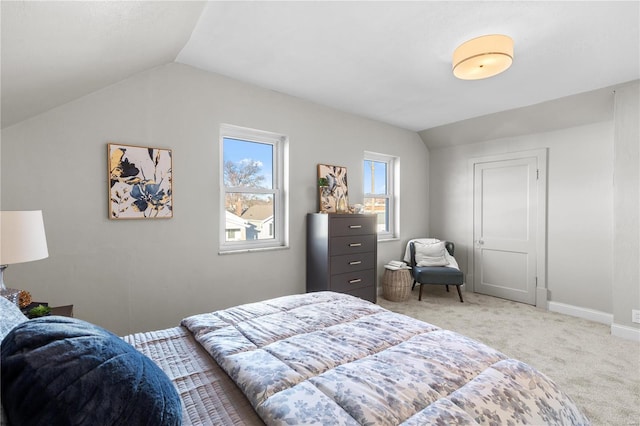 bedroom featuring vaulted ceiling, baseboards, and light colored carpet