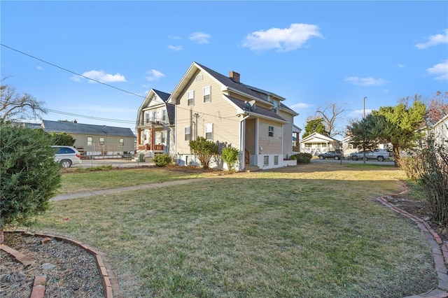 view of side of property with a chimney, a residential view, fence, and a lawn