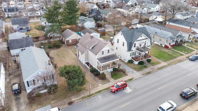 birds eye view of property with a residential view