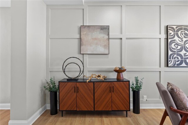details featuring wood finished floors and baseboards