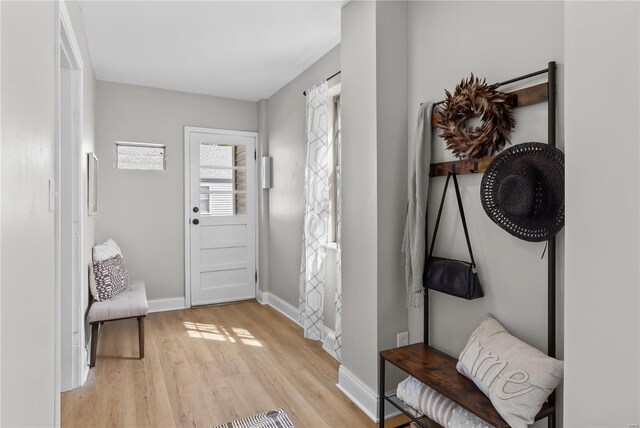 entryway featuring light wood-style floors and baseboards