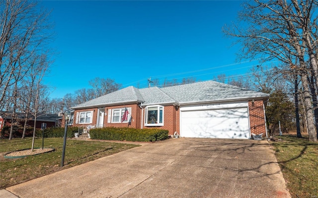 ranch-style home with a front yard and a garage