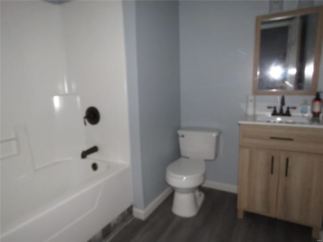 full bathroom featuring vanity, wood-type flooring, tub / shower combination, and toilet