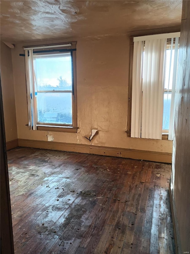 spare room with dark wood-type flooring