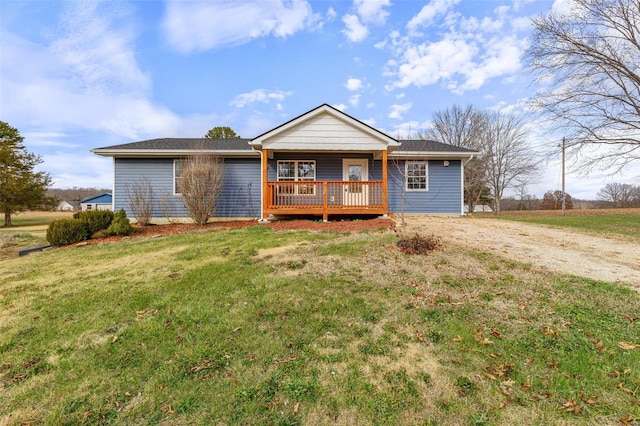 ranch-style home with a wooden deck and a front yard