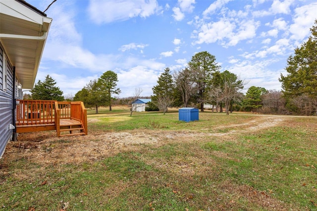 view of yard with a wooden deck