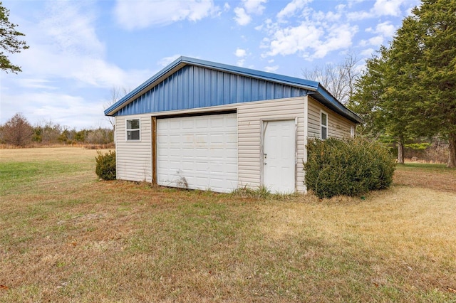 garage featuring a yard