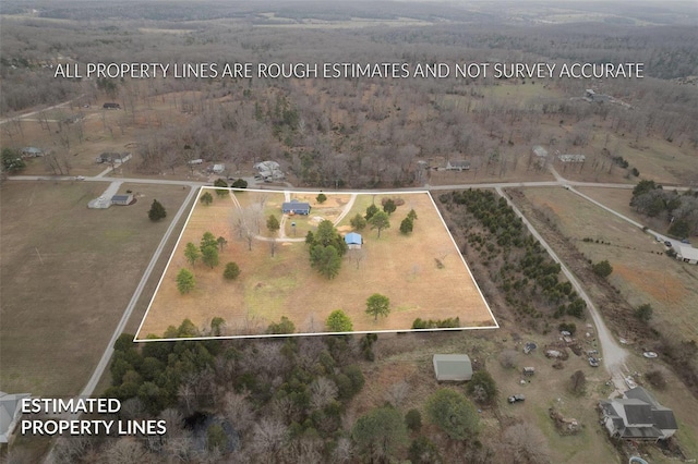 birds eye view of property featuring a rural view