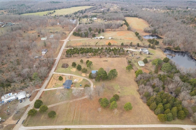 birds eye view of property with a water view and a rural view